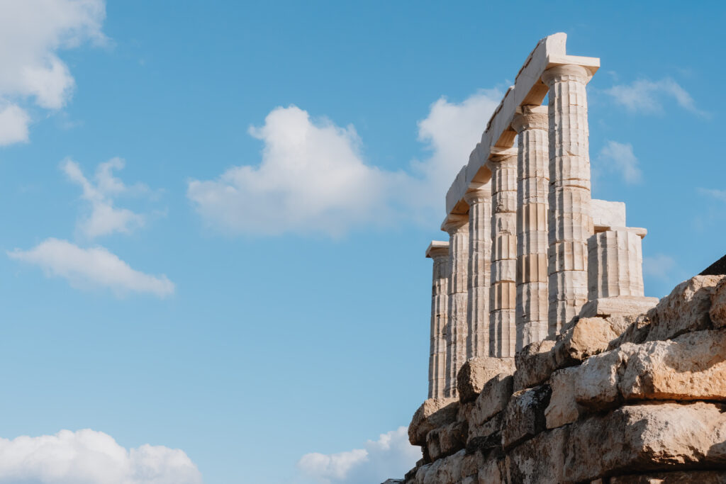 Ancient Columns Of The Temple Of Poseidon Under A Blue Sky