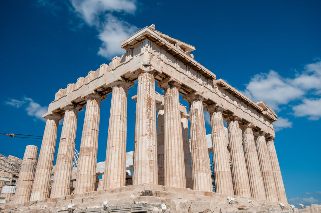 Ancient temple of parthenon with symmetrical columns at acropolis hill in Athens, Greece