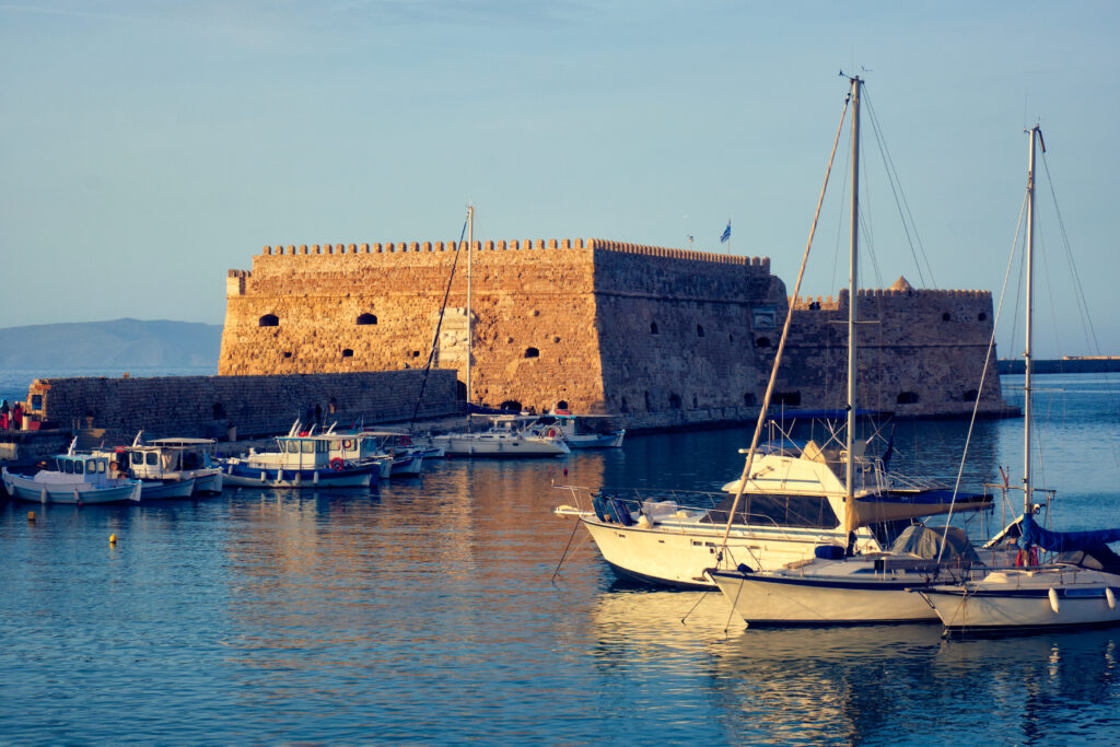 Venetian Fort in Heraklion and moored fishing boats, Crete Island, Greece